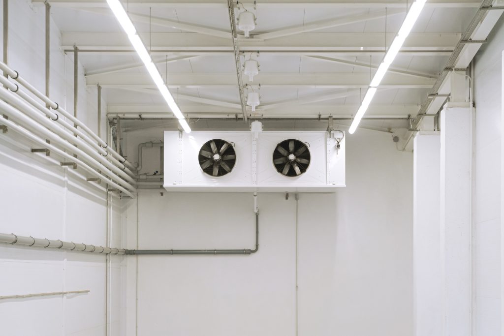 Industrial air conditioner box with fans. Compressor-condensing unit. Factory with air-conditioned and cooled.